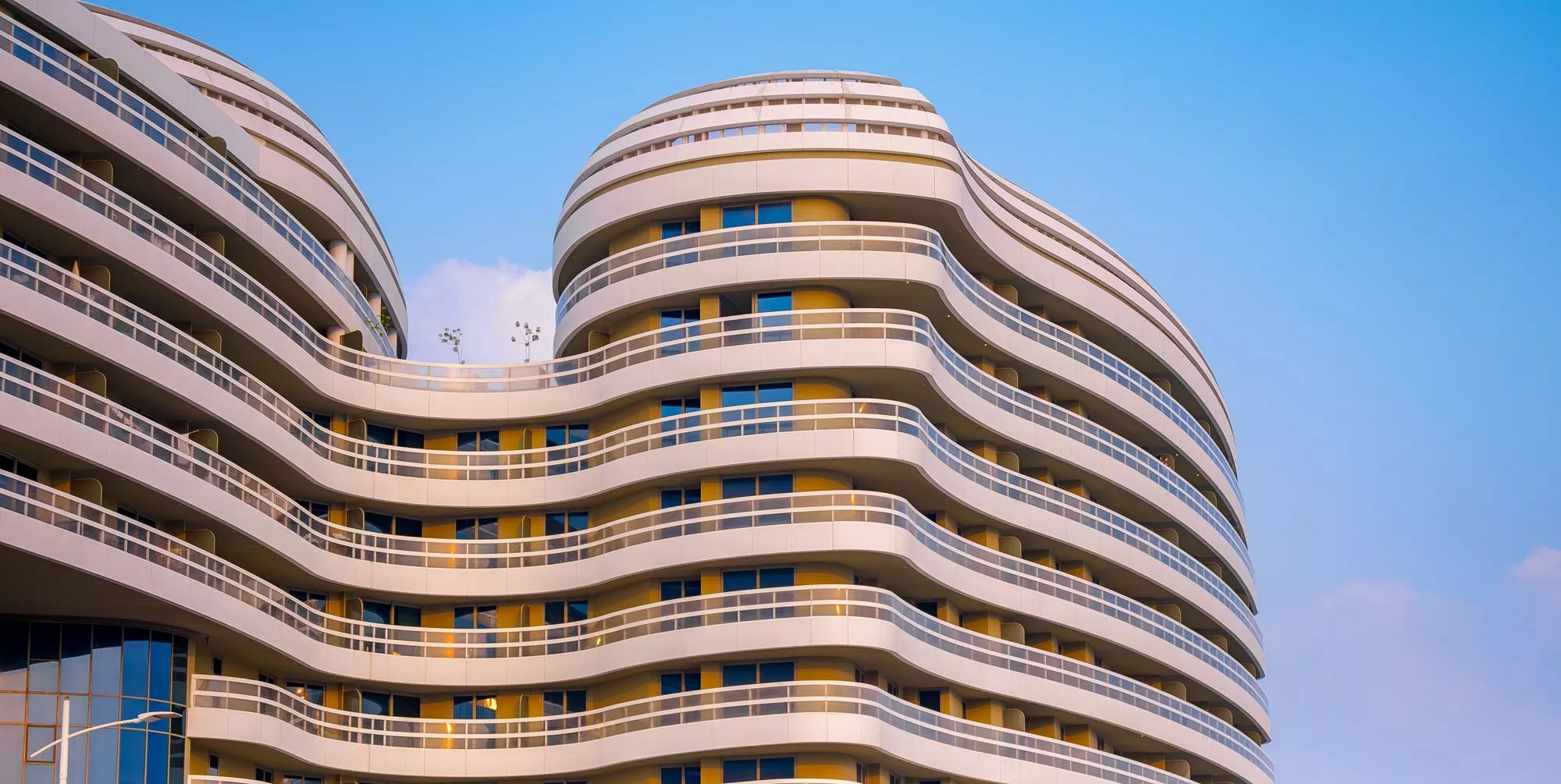 Waterfront perspective of Ajwan Towers highlighting its prime location on Saadiyat Island, Abu Dhabi.