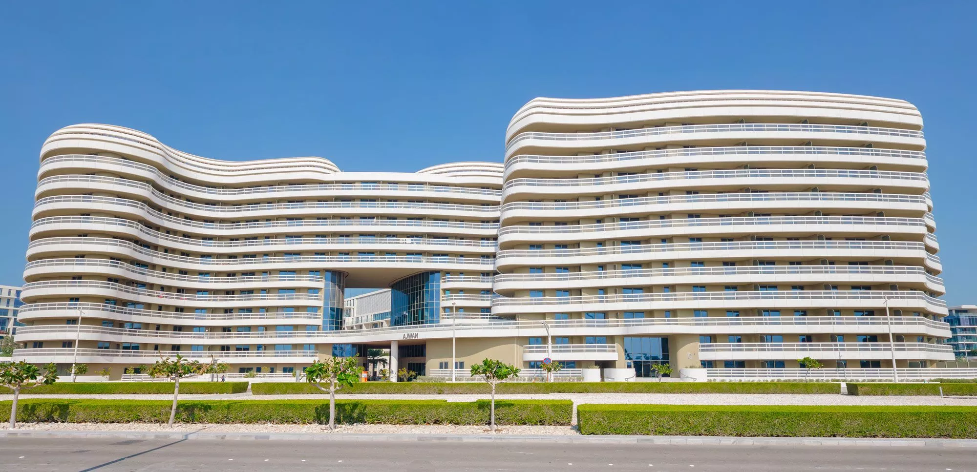 Night view of Ajwan Towers with illuminated facades reflecting the cultural sophistication of Abu Dhabi.