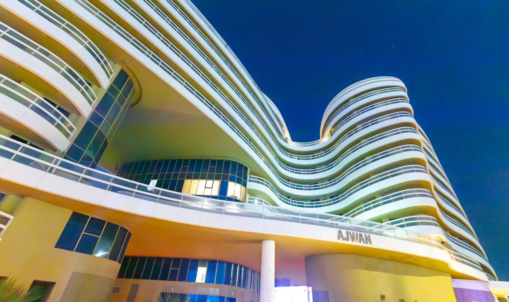 Exterior entrance of Ajwan Towers featuring modern design elements and premium finishes.